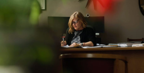 Mary E. Lentz sitting at her desk working