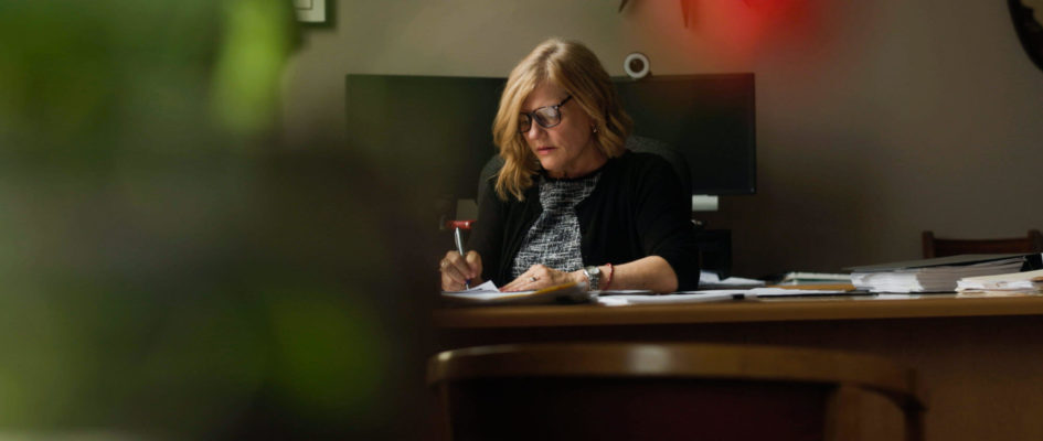 Mary E. Lentz sitting at her desk working